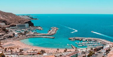 Bay in Puerto rico with hotels along the coast and blue sea